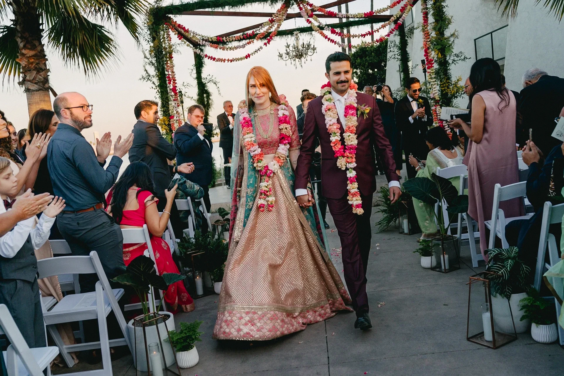 Couple walking down the aisle at wedding ceremony